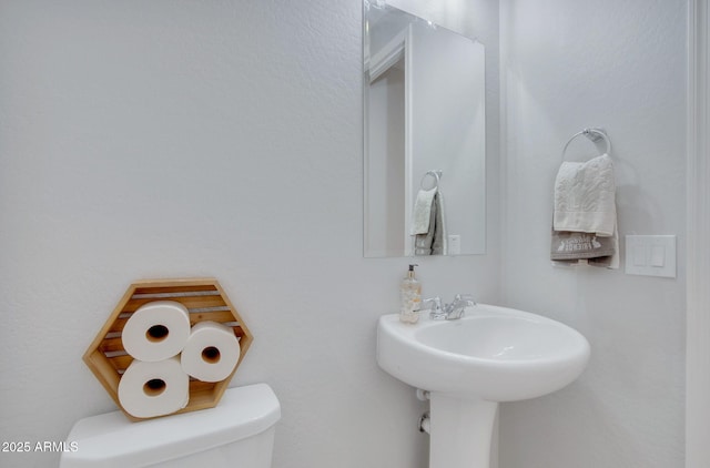 half bathroom with toilet