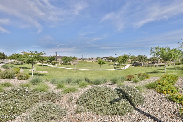 surrounding community featuring a lawn