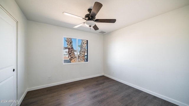 unfurnished bedroom featuring baseboards, visible vents, dark wood finished floors, and a ceiling fan