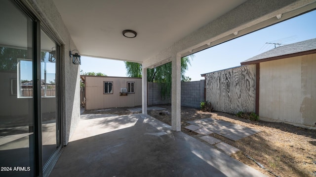 view of patio / terrace featuring a fenced backyard and an outdoor structure