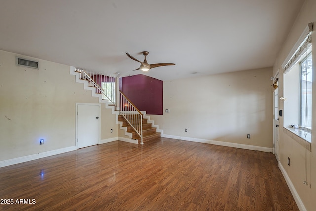 533 N Cobblestone St, Gilbert, AZ 85234 - unfurnished living room featuring a ceiling fan, stairs, healthy amount of natural light, and wood finished floors