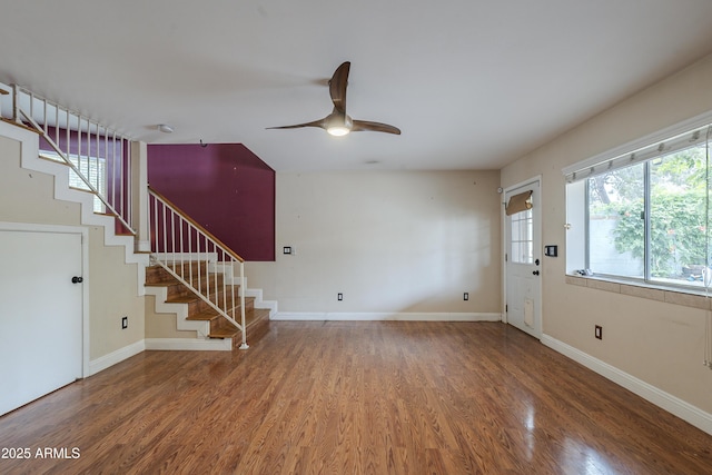 533 N Cobblestone St, Gilbert, AZ 85234 - unfurnished living room with wood finished floors, healthy amount of natural light, stairway, and ceiling fan