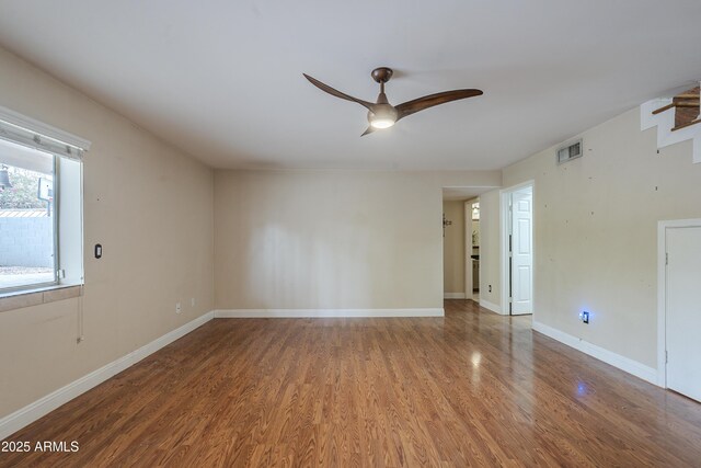 533 N Cobblestone St, Gilbert, AZ 85234 - unfurnished room featuring ceiling fan, wood finished floors, and baseboards