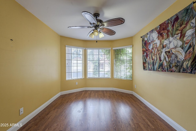 533 N Cobblestone St, Gilbert, AZ 85234 - spare room with ceiling fan, wood finished floors, and baseboards
