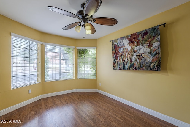 533 N Cobblestone St, Gilbert, AZ 85234 - spare room with a ceiling fan, wood finished floors, and baseboards