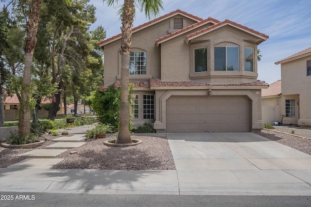 533 N Cobblestone St, Gilbert, AZ 85234 - mediterranean / spanish house with stucco siding, a tile roof, concrete driveway, and an attached garage