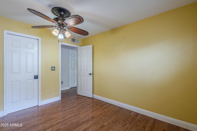 533 N Cobblestone St, Gilbert, AZ 85234 - unfurnished bedroom with baseboards, wood finished floors, and a ceiling fan