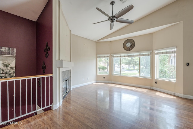 533 N Cobblestone St, Gilbert, AZ 85234 - unfurnished living room with high vaulted ceiling, a ceiling fan, wood finished floors, a fireplace, and baseboards