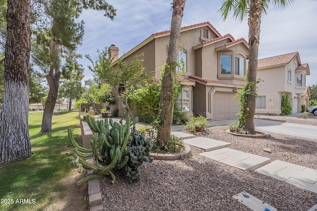 533 N Cobblestone St, Gilbert, AZ 85234 - mediterranean / spanish home with stucco siding, an attached garage, a tile roof, driveway, and a chimney