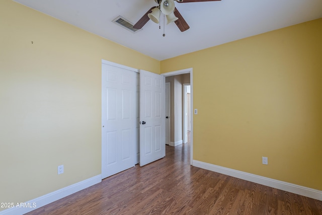 533 N Cobblestone St, Gilbert, AZ 85234 - unfurnished bedroom with baseboards, wood finished floors, a ceiling fan, and a closet