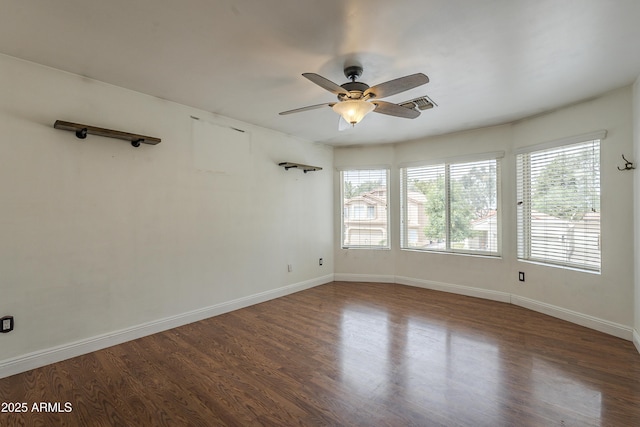 533 N Cobblestone St, Gilbert, AZ 85234 - unfurnished room featuring healthy amount of natural light, a ceiling fan, wood finished floors, and baseboards