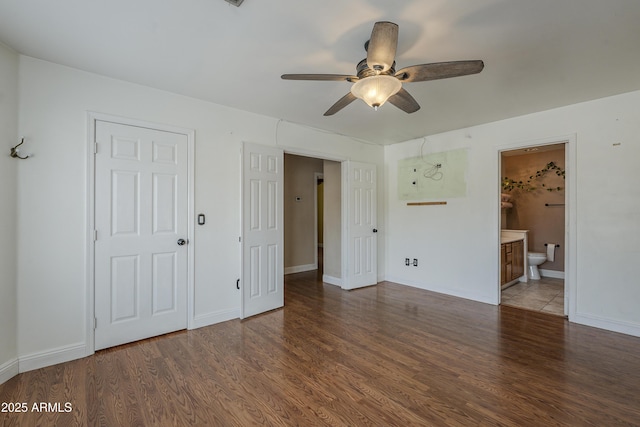 533 N Cobblestone St, Gilbert, AZ 85234 - unfurnished bedroom with wood finished floors, baseboards, ensuite bath, and ceiling fan