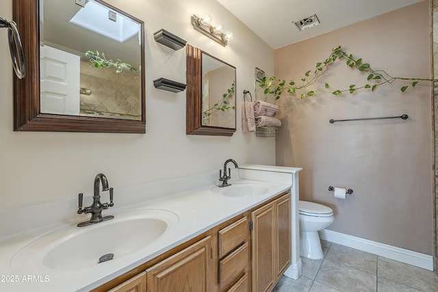 533 N Cobblestone St, Gilbert, AZ 85234 - bathroom with toilet, double vanity, tile patterned floors, a shower, and baseboards
