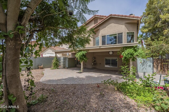 533 N Cobblestone St, Gilbert, AZ 85234 - view of front of house with stucco siding, a patio area, and a tiled roof
