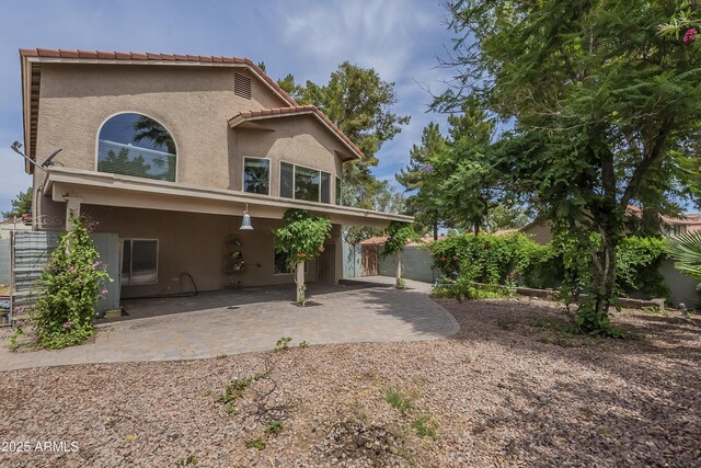 533 N Cobblestone St, Gilbert, AZ 85234 - view of front of property with stucco siding, a patio, a fenced backyard, and a tile roof