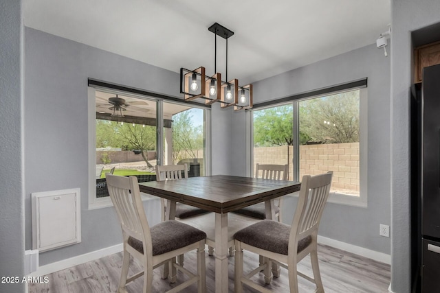 2934 S Woodruff Cir, Mesa, AZ 85212 - dining space with light wood-type flooring and a chandelier