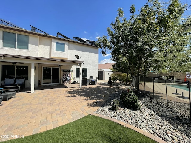 2934 S Woodruff Cir, Mesa, AZ 85212 - back of property featuring ceiling fan, a patio area, stucco siding, and an outdoor hangout area