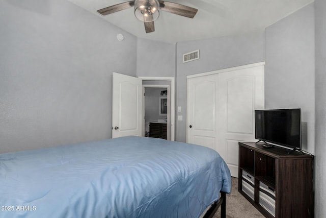 2934 S Woodruff Cir, Mesa, AZ 85212 - carpeted bedroom with lofted ceiling, ceiling fan, and a closet