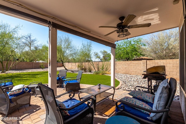 2934 S Woodruff Cir, Mesa, AZ 85212 - fenced backyard with an outdoor living space, a ceiling fan, and a patio area