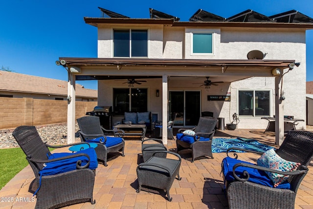 2934 S Woodruff Cir, Mesa, AZ 85212 - back of house with ceiling fan, an outdoor living space, stucco siding, and a patio area
