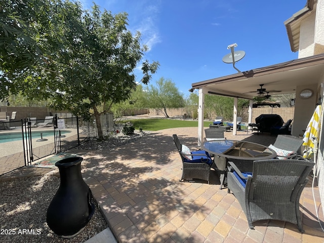 2934 S Woodruff Cir, Mesa, AZ 85212 - fenced backyard with a ceiling fan, outdoor dining area, and a patio