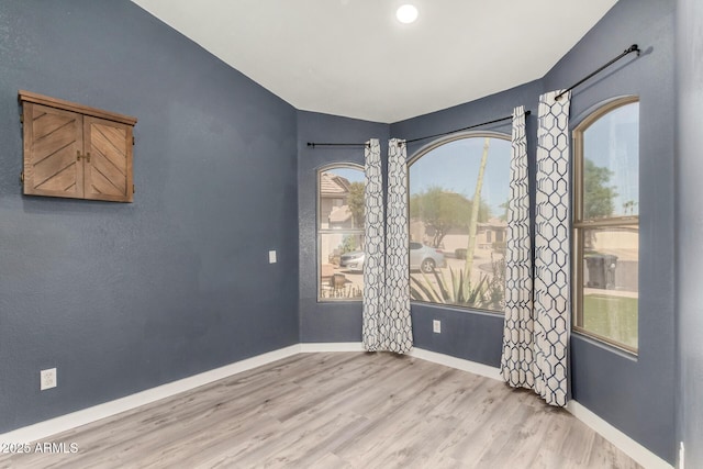 2934 S Woodruff Cir, Mesa, AZ 85212 - empty room featuring wood finished floors and lofted ceiling