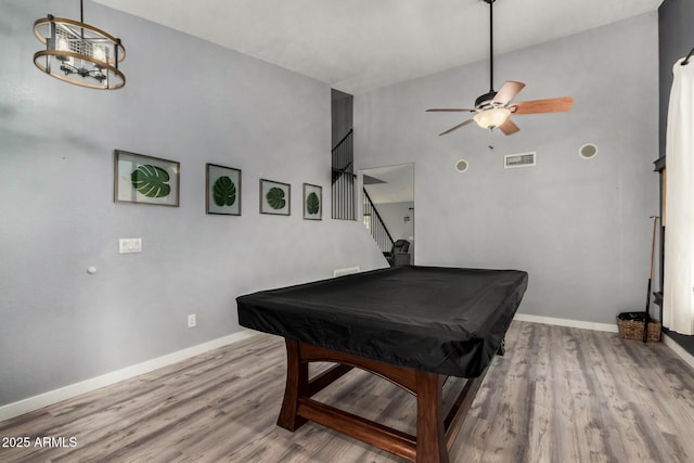 2934 S Woodruff Cir, Mesa, AZ 85212 - rec room with pool table, wood finished floors, a ceiling fan, a towering ceiling, and a chandelier