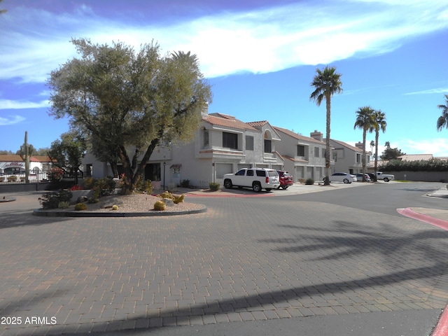 view of street with a residential view and curbs