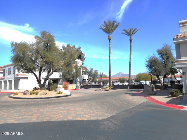 view of street with curbs and a mountain view