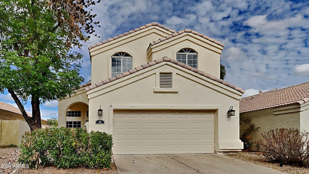 mediterranean / spanish-style house featuring a garage