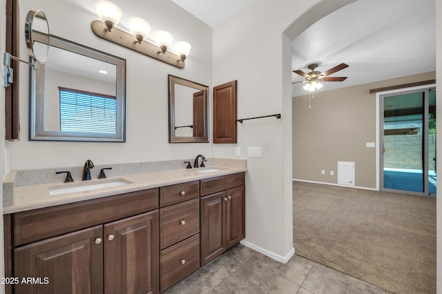 17429 W Red Bird Rd, Surprise, AZ 85387 - bathroom featuring a sink, baseboards, a ceiling fan, and double vanity