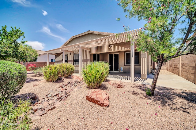 17429 W Red Bird Rd, Surprise, AZ 85387 - rear view of house featuring a patio, a fenced backyard, stucco siding, and a pergola