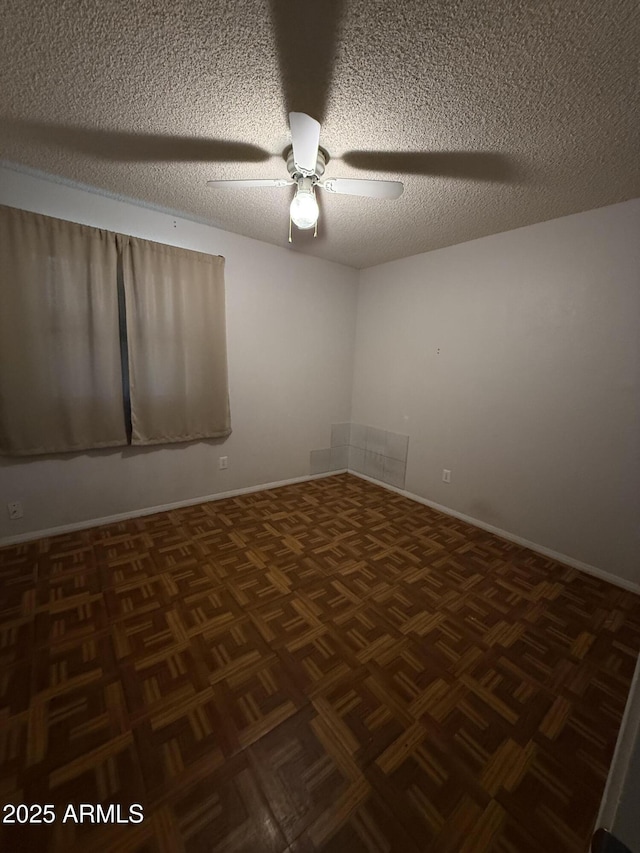 4231 N 69th Dr Unit 1297, Phoenix, AZ 85033 - empty room featuring a textured ceiling, ceiling fan, and baseboards