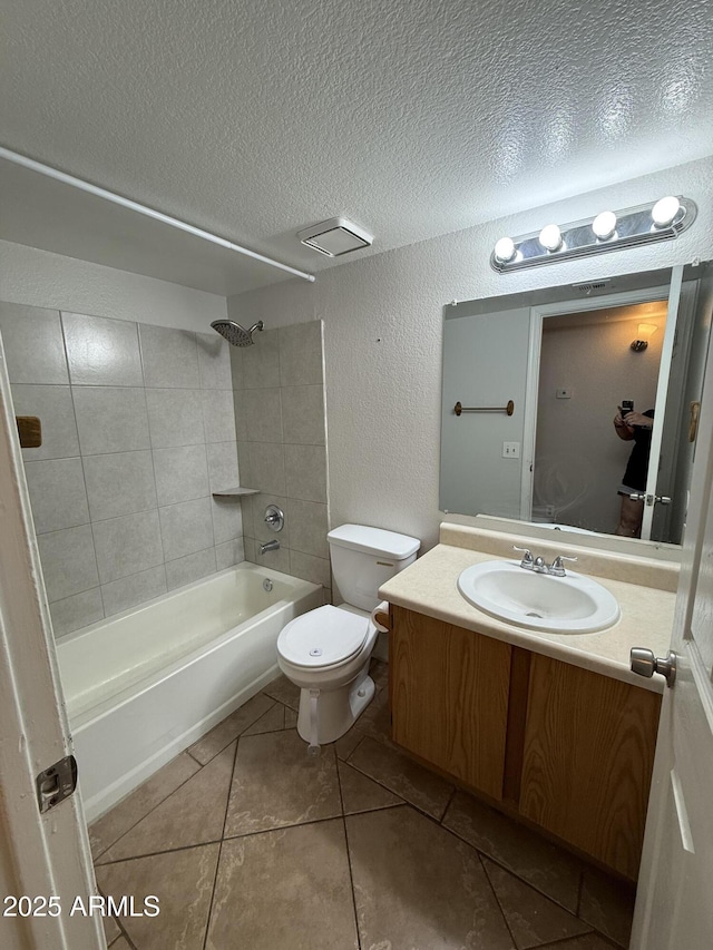 4231 N 69th Dr Unit 1297, Phoenix, AZ 85033 - bathroom featuring a textured ceiling, tile patterned flooring, a textured wall, toilet, and vanity