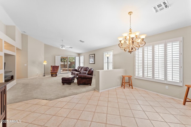 living room featuring light tile patterned floors, vaulted ceiling, visible vents, and light colored carpet