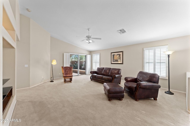 living area featuring visible vents, light carpet, ceiling fan, high vaulted ceiling, and baseboards