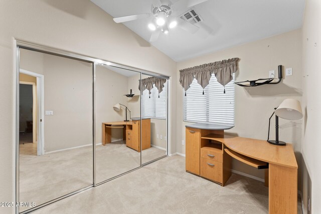 office space with lofted ceiling, light colored carpet, visible vents, ceiling fan, and baseboards