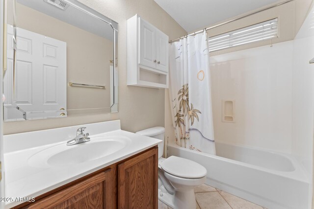 bathroom featuring visible vents, toilet, shower / tub combo with curtain, tile patterned floors, and vanity