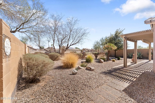 view of yard with a patio area, a fenced backyard, and a pergola