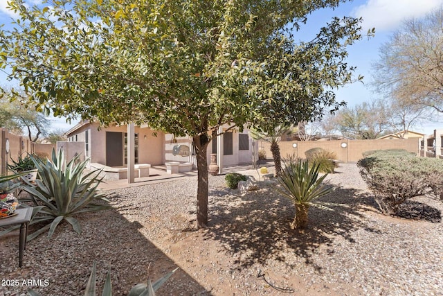 view of yard featuring a patio and a fenced backyard