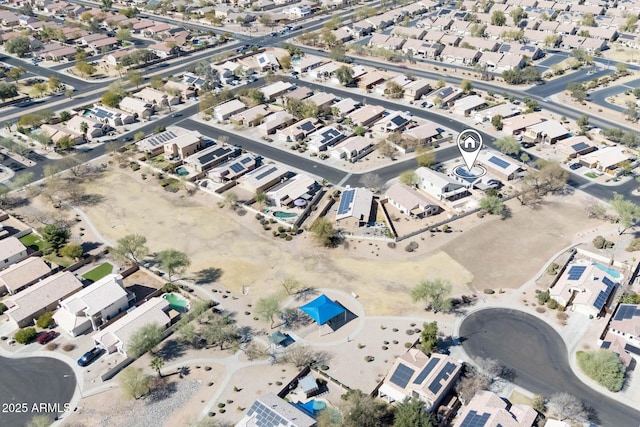 birds eye view of property with a residential view