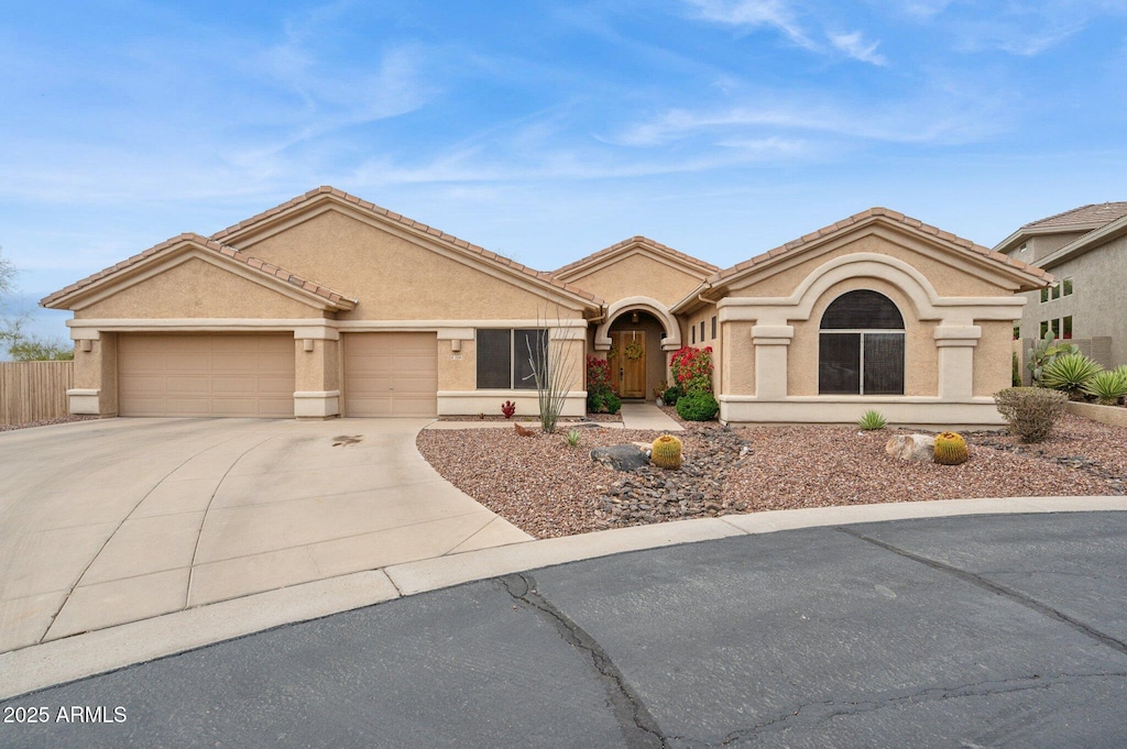 5210 E Calle De Baca, Cave Creek, AZ 85331 - view of front of house with driveway, a garage, stucco siding, and fence