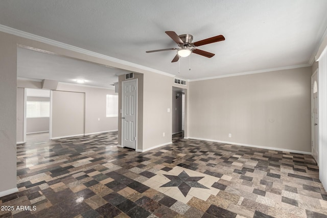 spare room with crown molding, a ceiling fan, and baseboards