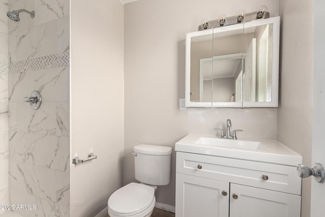 full bath with a marble finish shower, toilet, and vanity