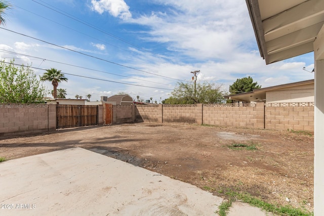 view of yard featuring a patio area and fence