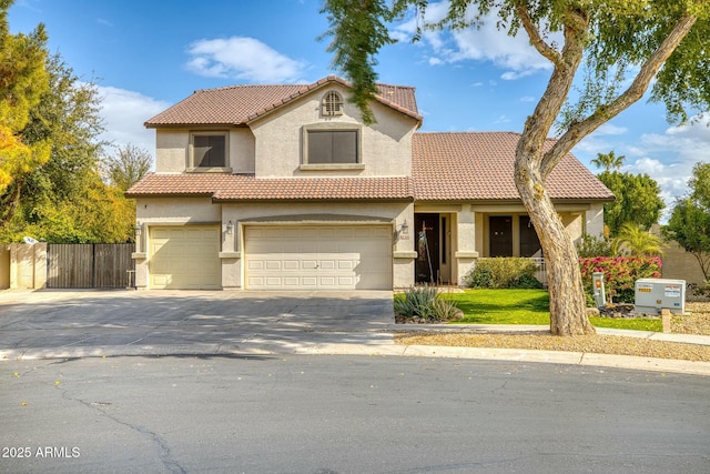 mediterranean / spanish house with a garage