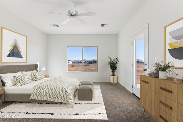 bedroom featuring ceiling fan and carpet