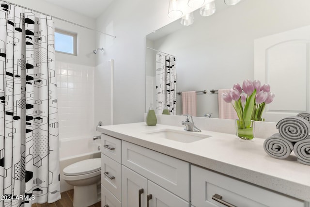 full bathroom with vanity, toilet, wood-type flooring, and shower / bath combo with shower curtain