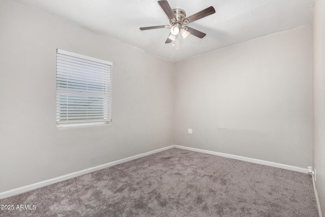 spare room with ceiling fan and carpet floors