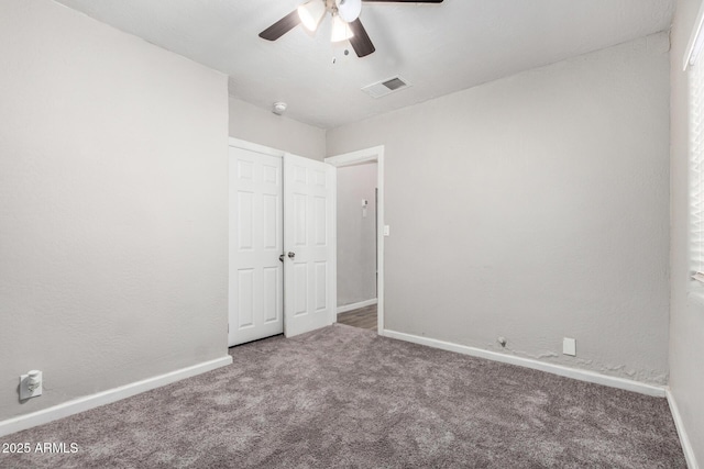 unfurnished bedroom featuring carpet flooring and ceiling fan